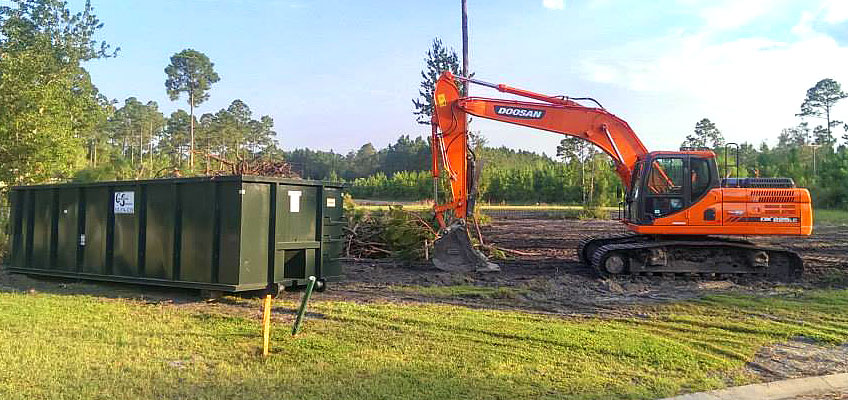 CS heavy equipment with roll-off container