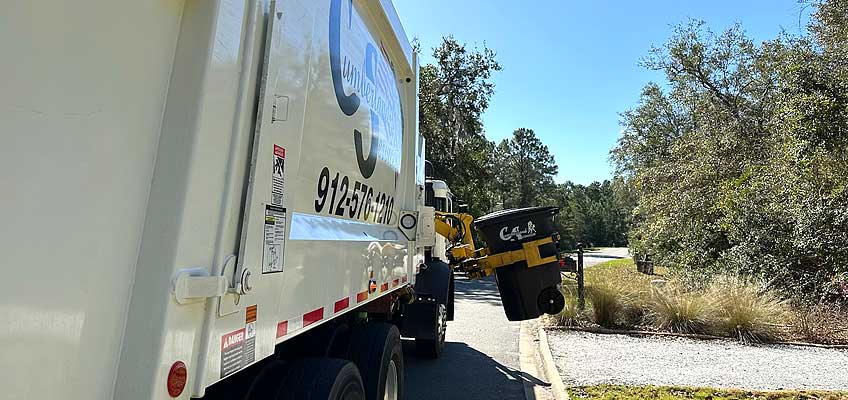 Cumberland Services Automatic Side-Loading truck in action.