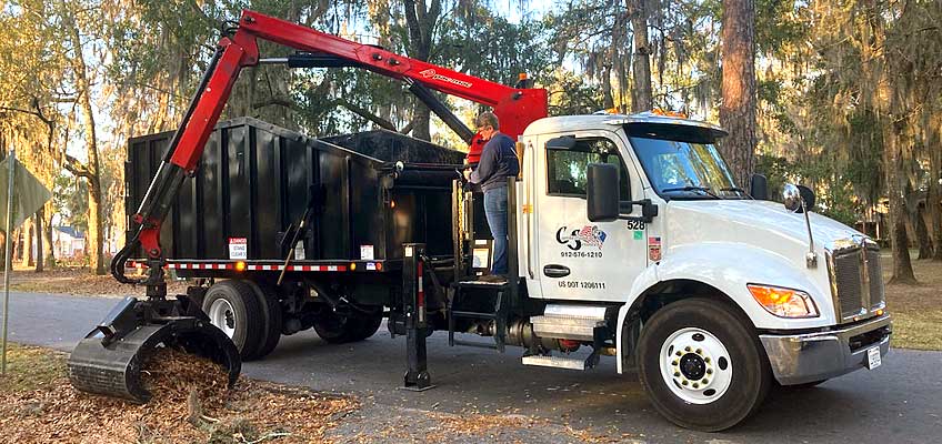 Cumberland Services Grapple truck in action.