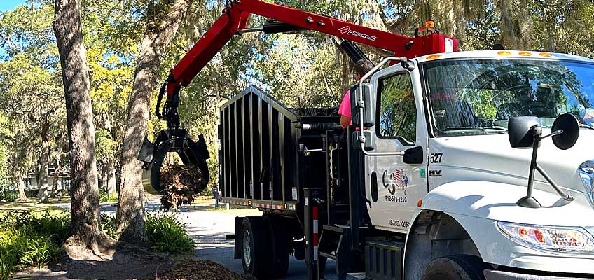 Cumberland Services Grapple truck in action.