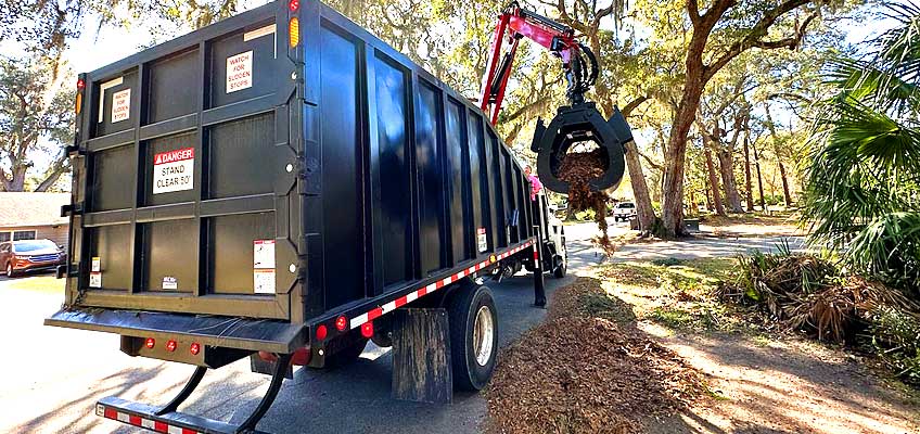 Cumberland Services Grapple truck in action.